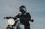 man riding a motorcycle with complete gear